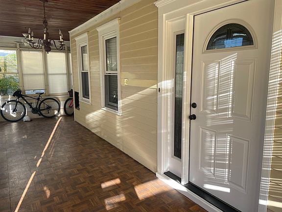 Shared enclosed front porch.