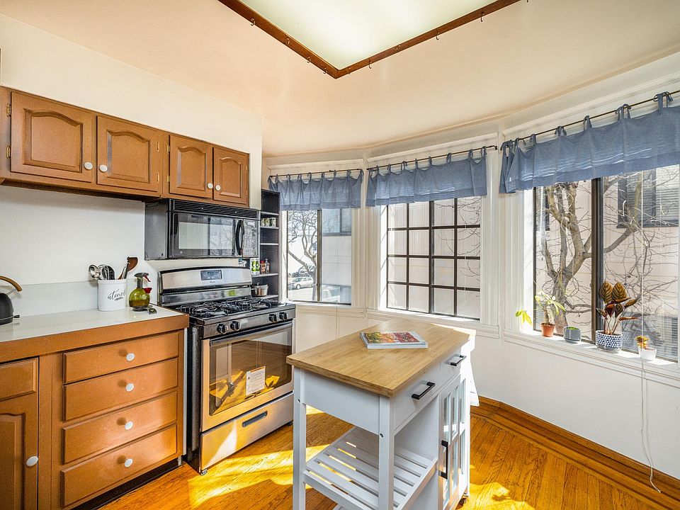 Large kitchen with bay windows.
