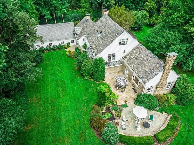Welcome to 910 Fox Chapel Road in Fox Chapel Borough. Exceptionally situated on 4.01 private picturesque acres adjacent to the F