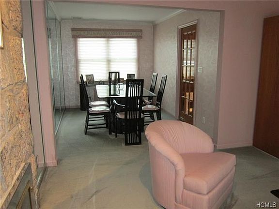 The formal dining room with its access door leading into the ren