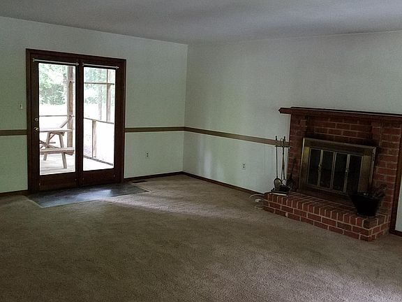 Living room with French doors lead to back deck,