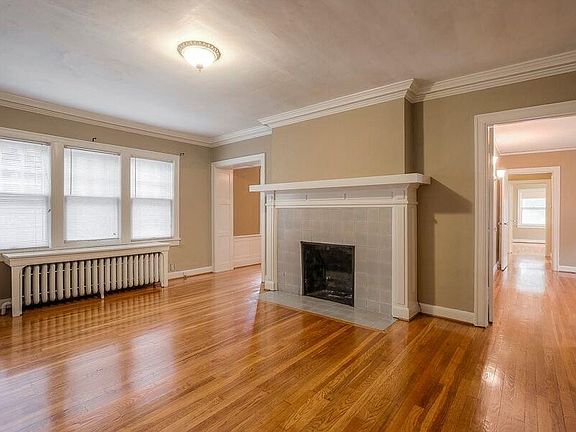 Formal living room with original fireplace.