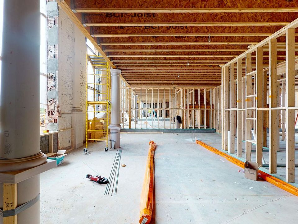 Light Filled Spaces with Soaring Ceilings and Original Architectural Details Throughout