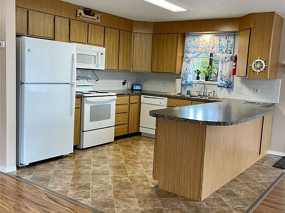 Kitchen has new appliances and lots of work space.