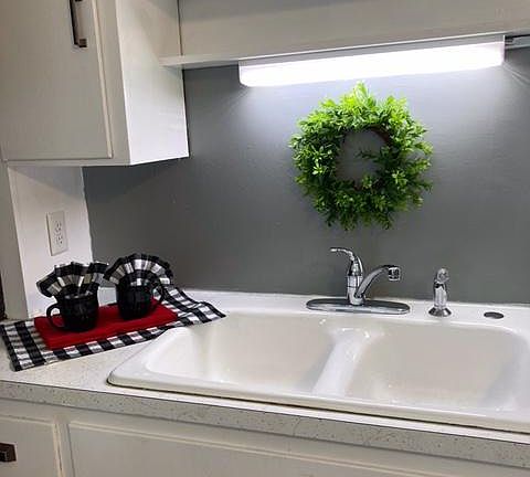 Nice new double sink and faucet and sprayer and a nice handy light above sink!