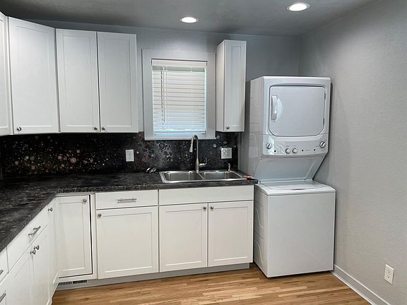 Kitchen with stacked Laundry