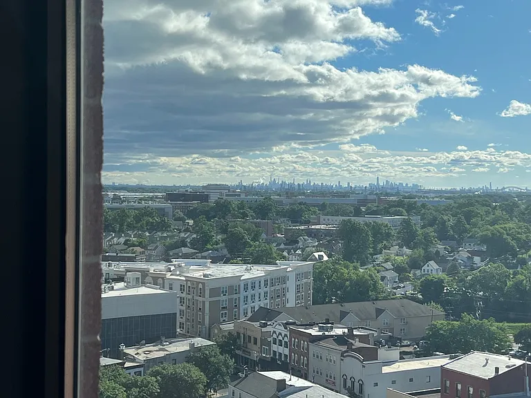 living room and bedroom window view of NYC skyline