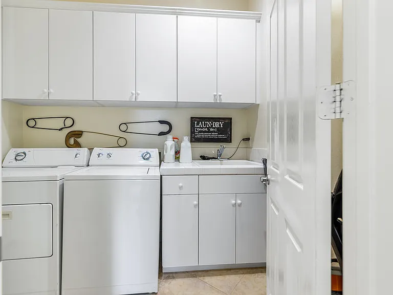 FULL SIZE WASHER DRYER THERE IS A SINK IN THE LAUNDRY ROOM