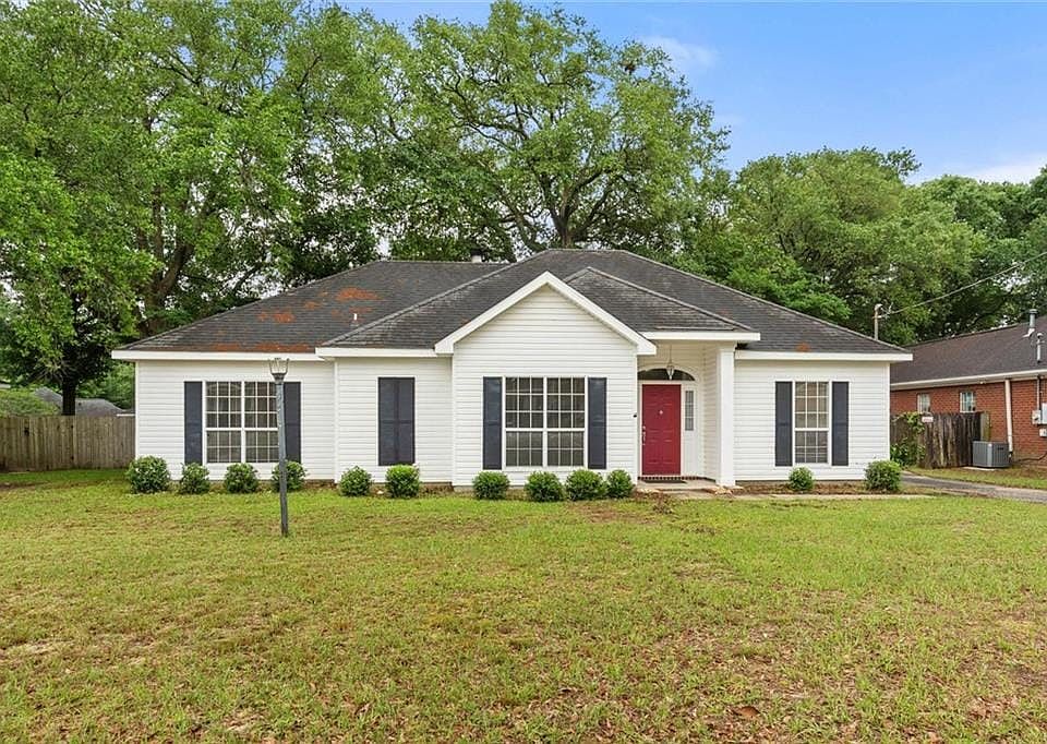 Ranch-style home with central AC unit