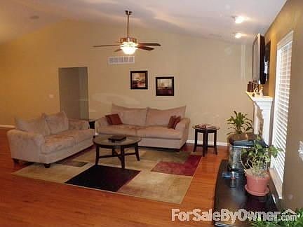 Living Room : Hardwood floors and recessed lighting.