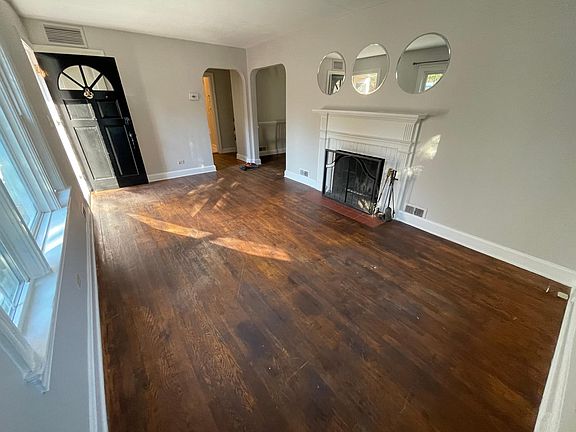 living room with wood burning fireplace. 18x10'9"