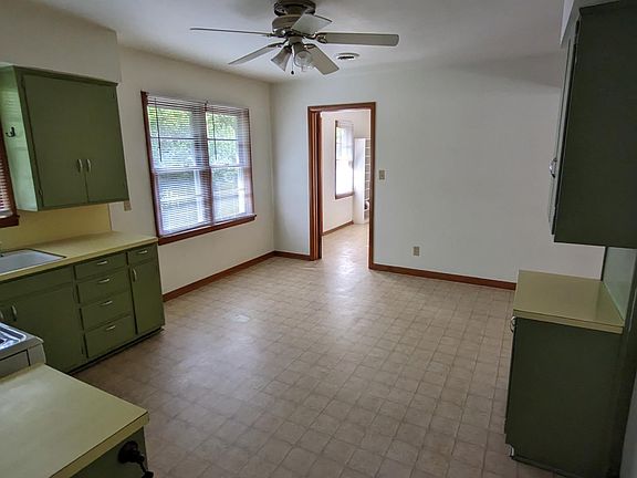 Kitchen area, showing laundry area entrance.