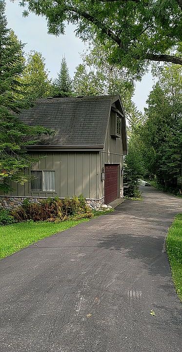 Garage and paved driveway