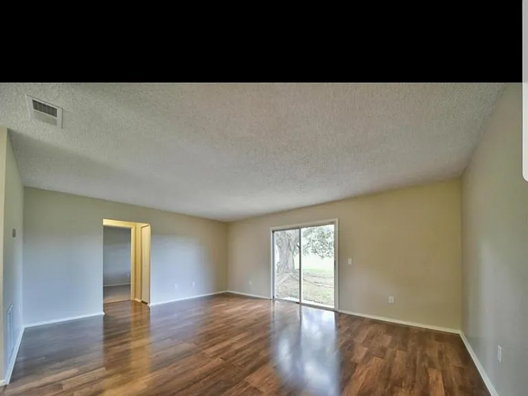 Living room & rear exit, sliding glass door