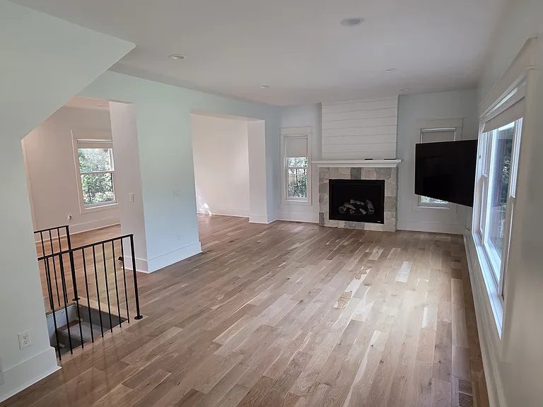 Living area rear and front. Showing stairs to basement.