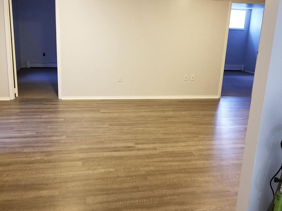 Looking from Kitchen thru Living Room to both bedroom and of