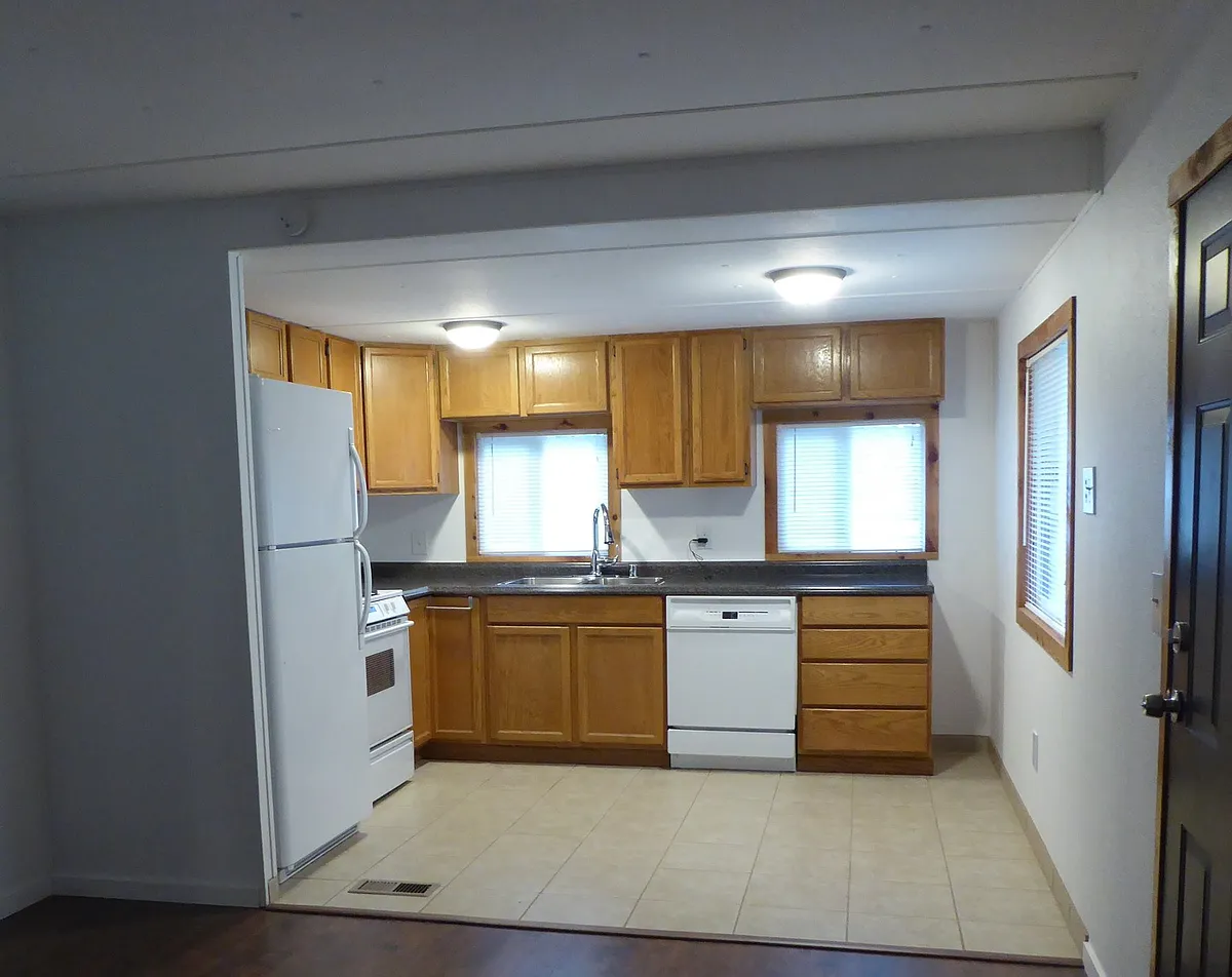 Kitchen with propane range. - E Carr Pl W