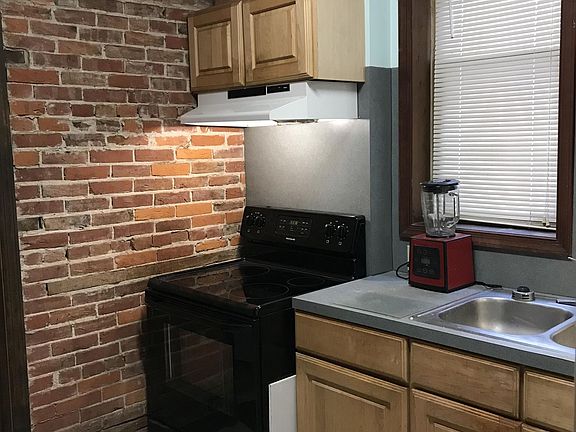 Kitchen flat top range and sink area