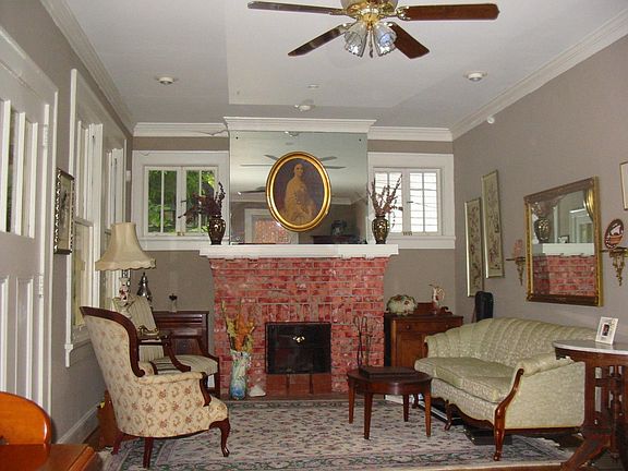Front room is LONG - this is the north end of Living Room. Glassed in porch is to the left. Dining room is to the right.