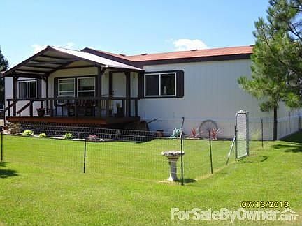 Front of Home. : Fenced in front yard.