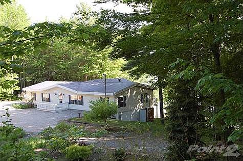 Solid house with partial basement and metal roof system