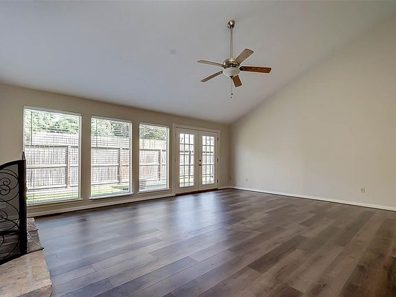French doors lead to the beautiful patio in the fully fenced backyard.