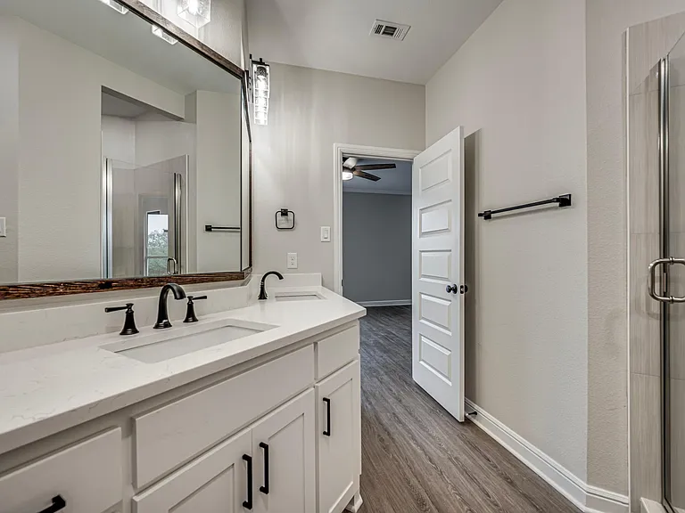 Master bathroom comes with double sink and walk in shower