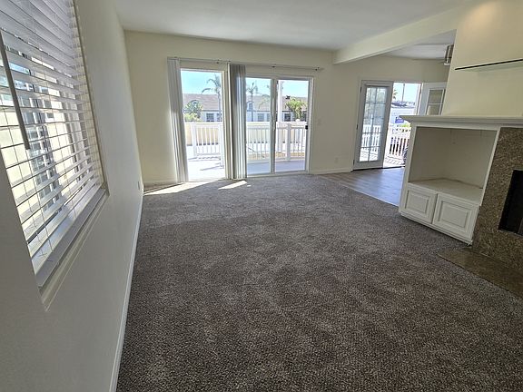 Living room with view of deck in background
