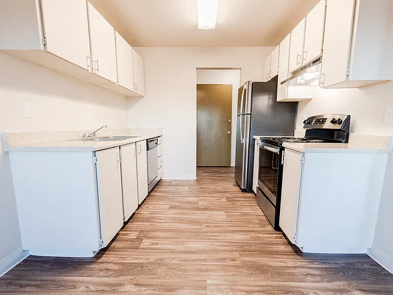 Lakewood Apartments - Arbor Pointe Apartments - Kitchen and Entryway, from Dining Room