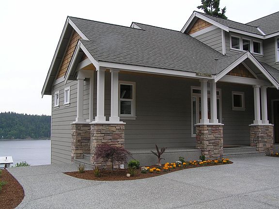 front of the home with water view behind