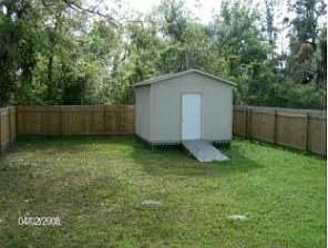 Fenced backyard w shed