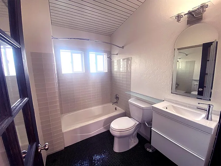 Upstairs bathroom with new tub and tile
