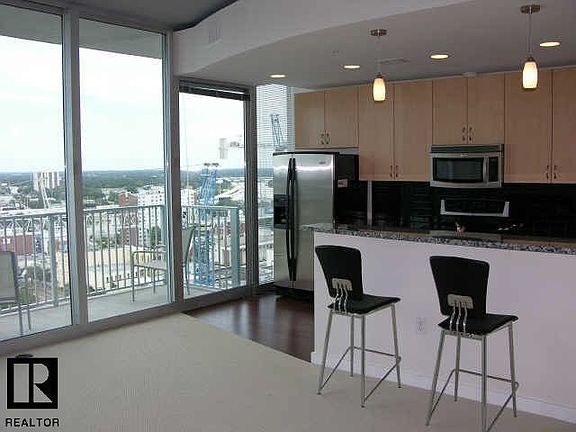 Double Pain Sliders to Balcony off of Kitchen