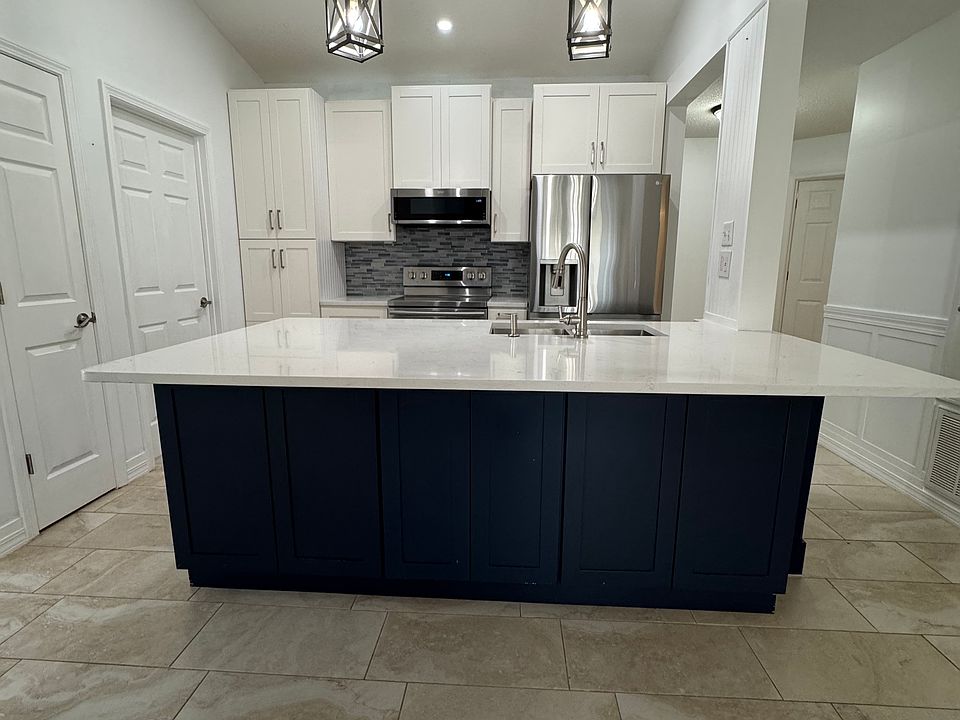 New real wood kitchen with large island and double pantry