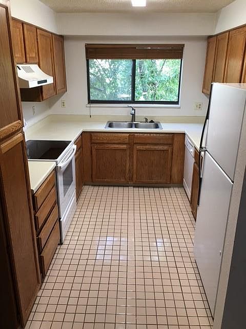 Kitchen with all appliances ceramic tile floor