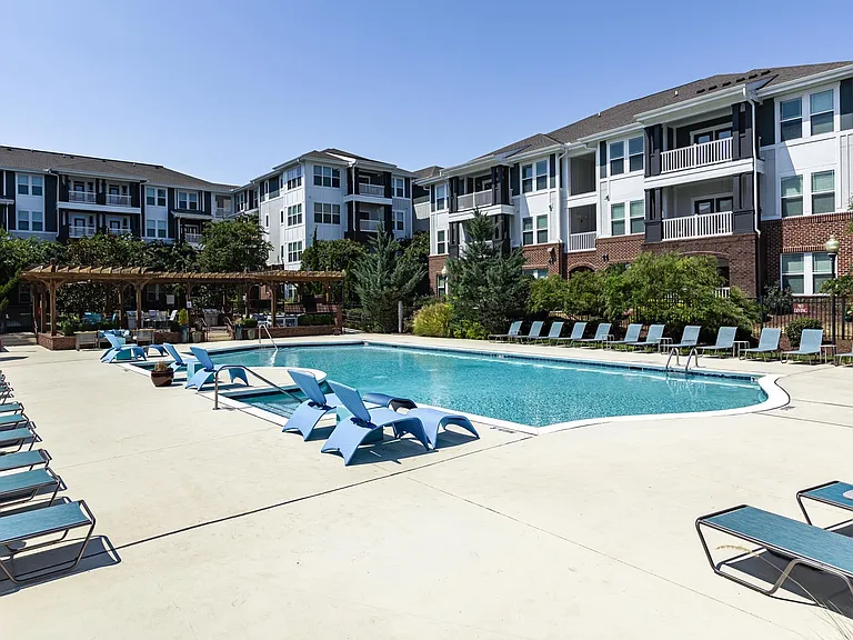 Sparkling Pool Area with Sun Deck