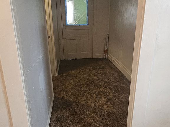 Hallway to bedroom and enclosed porch
