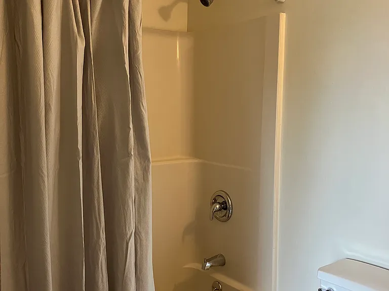 Bathroom with full bathtub & shower