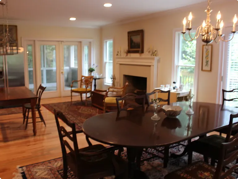 Lovely kitchen with dining area, French doors to screened in porch, wrap around porch with gas grill. Doggie door to fenced in yard.