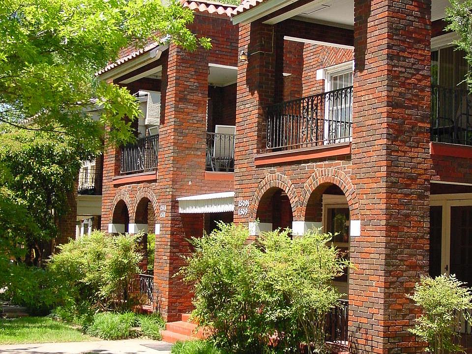 Exterior of fourplex last summer