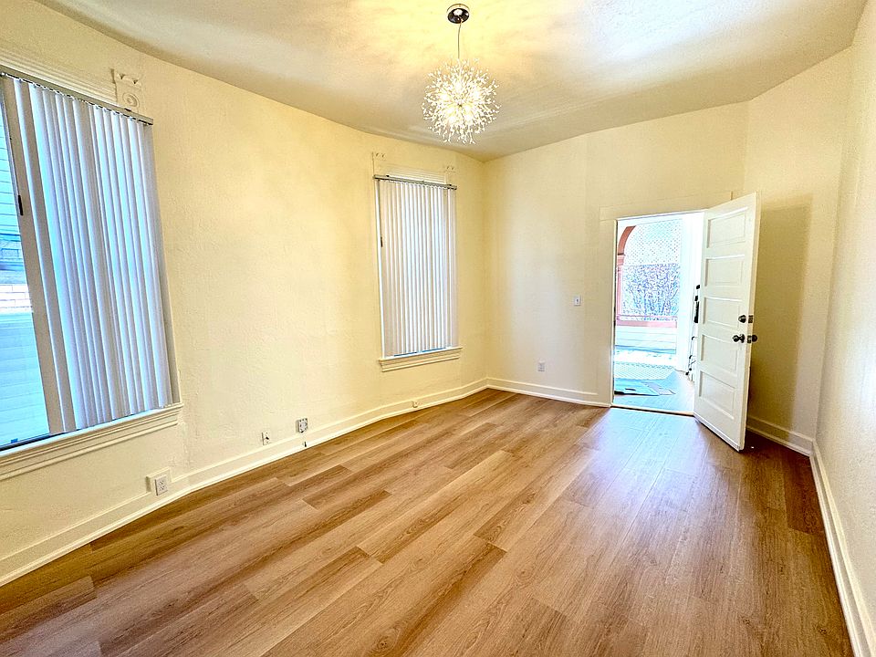 Living room with brand new flooring and light fixture