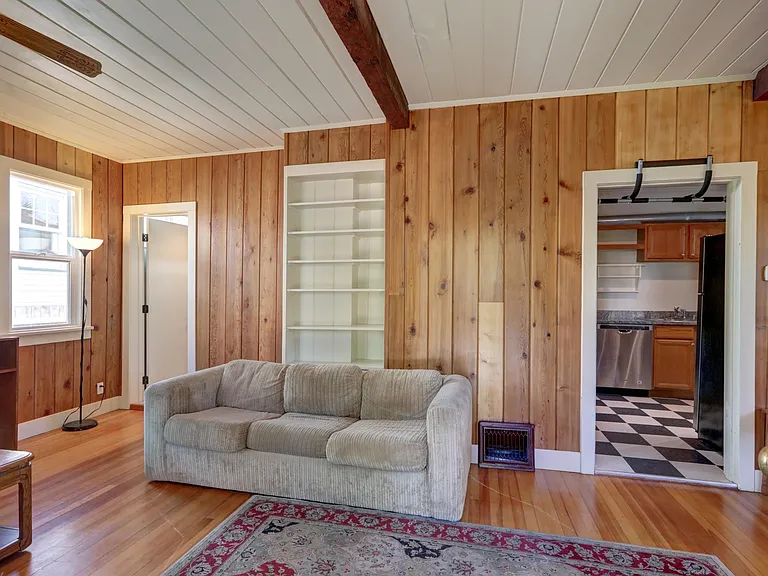 Warm, inviting living room. Real wood paneling and floors!