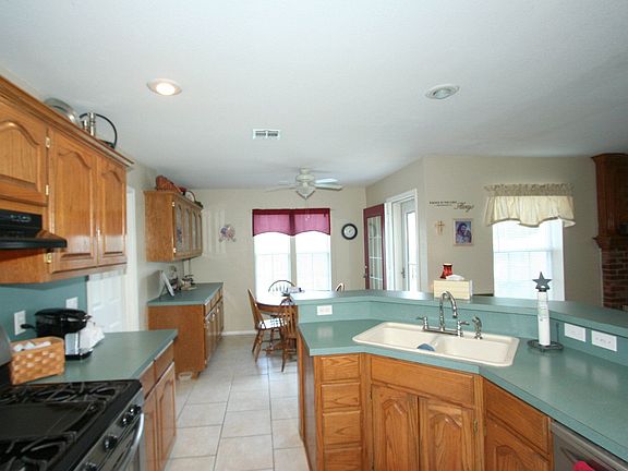 Kitchen opens to breakfast nook and living room.