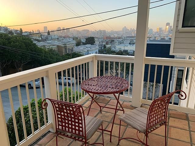 Front porch includes bistro set and sweeping view of downtown.