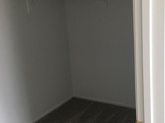 large walk-in closet in master bedroom