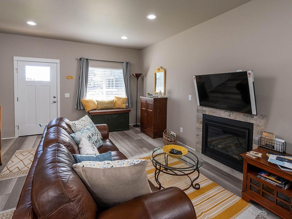 Stay cozy next to the fire and enjoy a beverage and a movie on your flat screen too!
