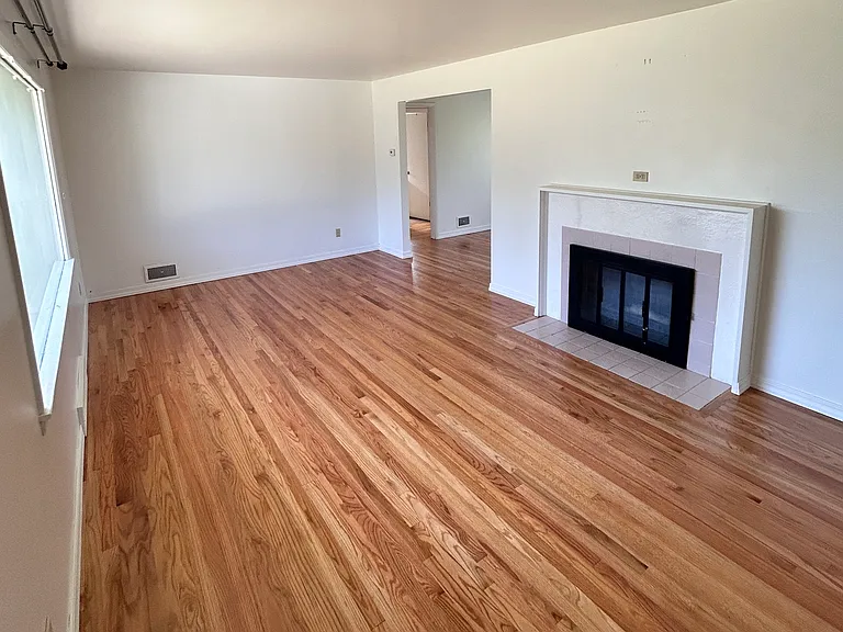 Living room from front entry - floors refinished July 2026