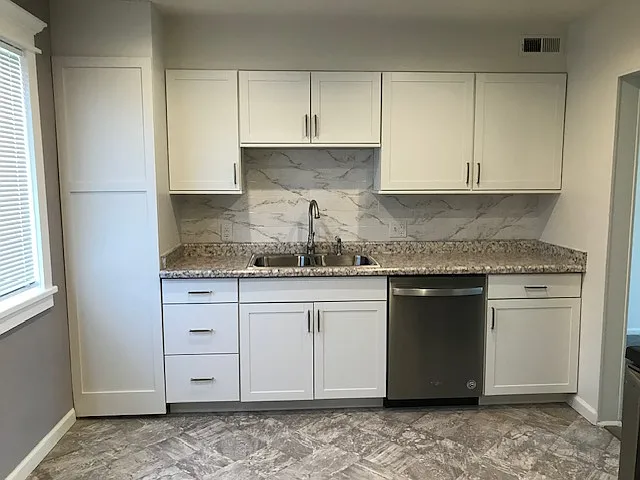 Behind floor to sealing cabinet is a 40 gallon water heater and a water shut off valve. You will have plenty of water for your showers and the peace of mind that comes from being protected from a water emergence.