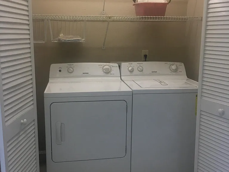 Laundry area within Kitchen by entrance from Garage