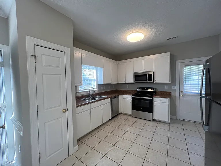 Kitchen... New Stainless Steel Refrigerator and NEW Stainless Steel Stove